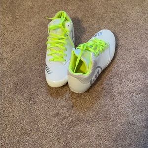 new white cleats with highlighter color laces